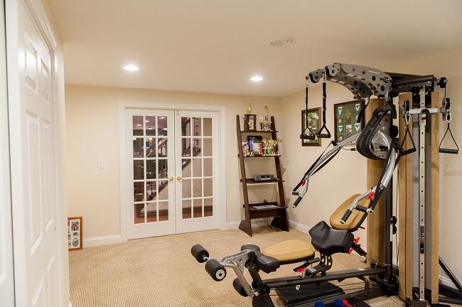 NJ finished basement with gym equipment